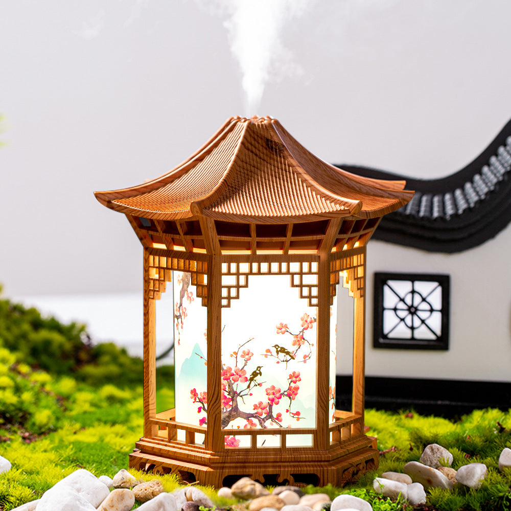 Humidifier night light lantern in light wood with fine mist rising from top