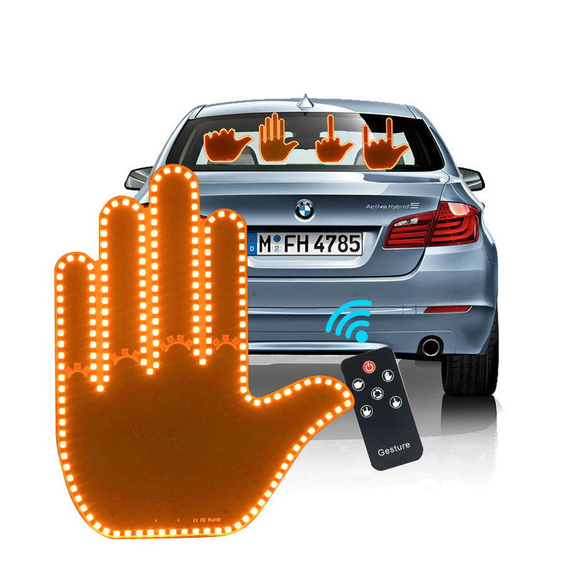 LED gesture hand car light with small black remote, orange-lit hand on rear window