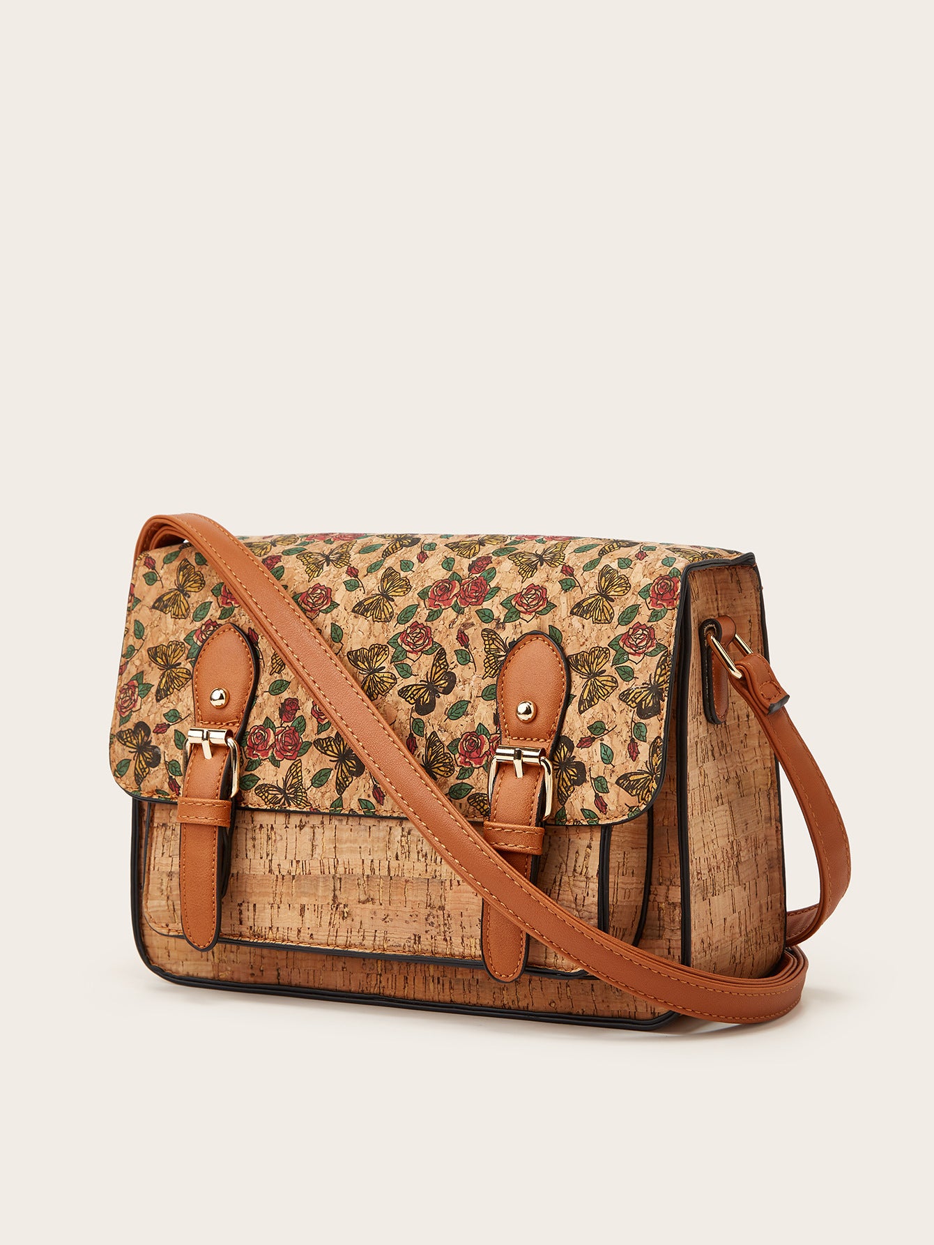 Women’s crossbody bag with green floral print flap and cork-style front panel
