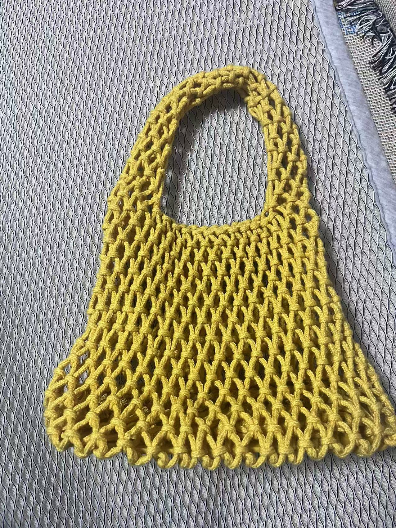 Lime green hollow net rope bucket bag with curved loop handle, crocheted texture