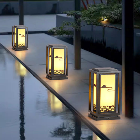 Rectangular solar lantern light with black frame, warm glow through frosted panels