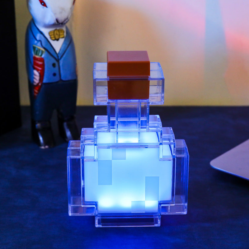 Blue translucent Minecraft-style cube night light with dark brown top and white glow