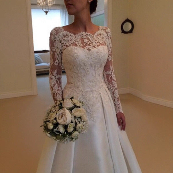 Ivory lace wedding dress with long sleeves, sweetheart neckline, fitted waist and flared skirt