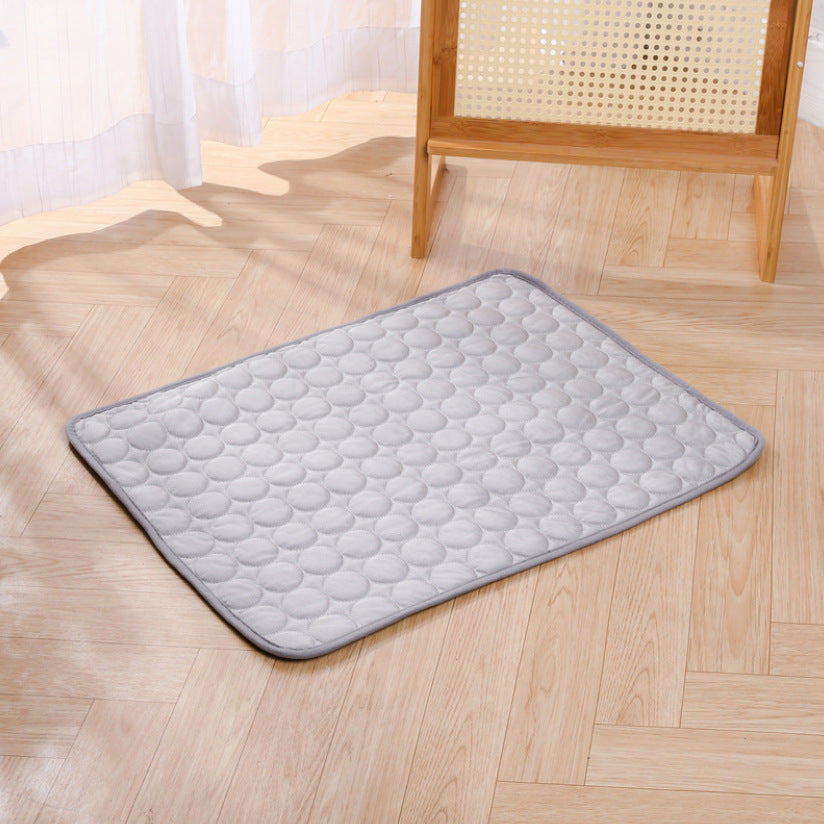Gray ice silk cooling mat with raised pebble texture and dark edge piping