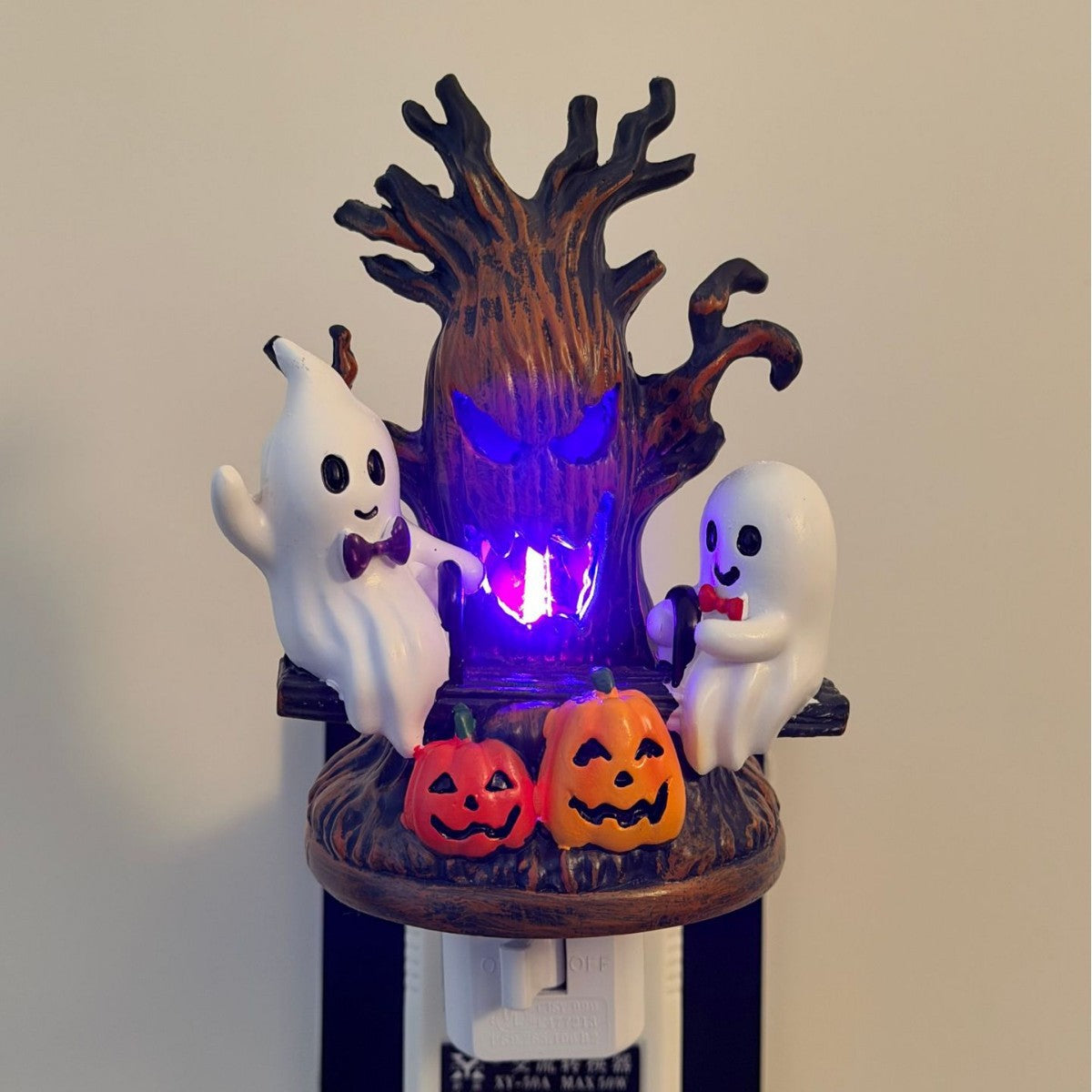 Halloween swing ghost night light with purple glowing haunted tree, two ghosts, and jack-o’-lanterns