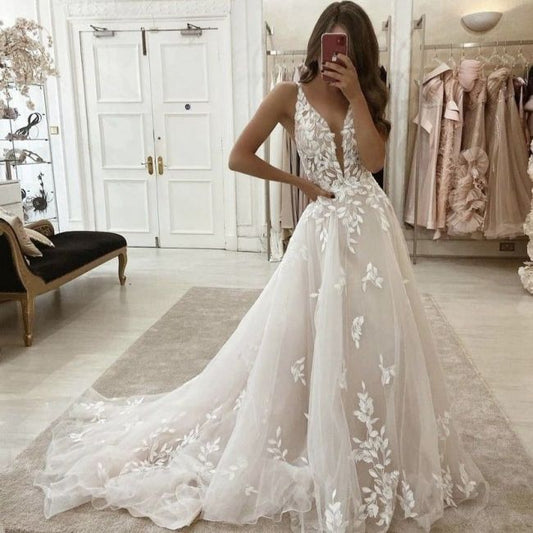 Wedding dress with floral lace bodice and full tulle skirt