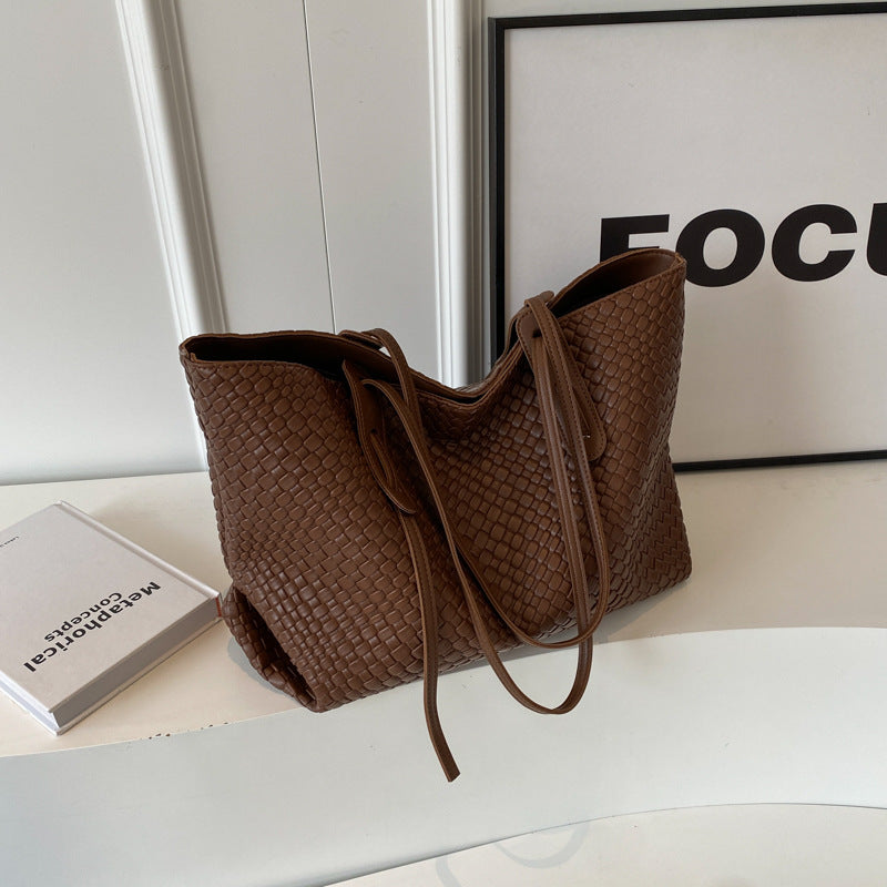 Woven PU tote bag in brown with two top handles and long shoulder strap