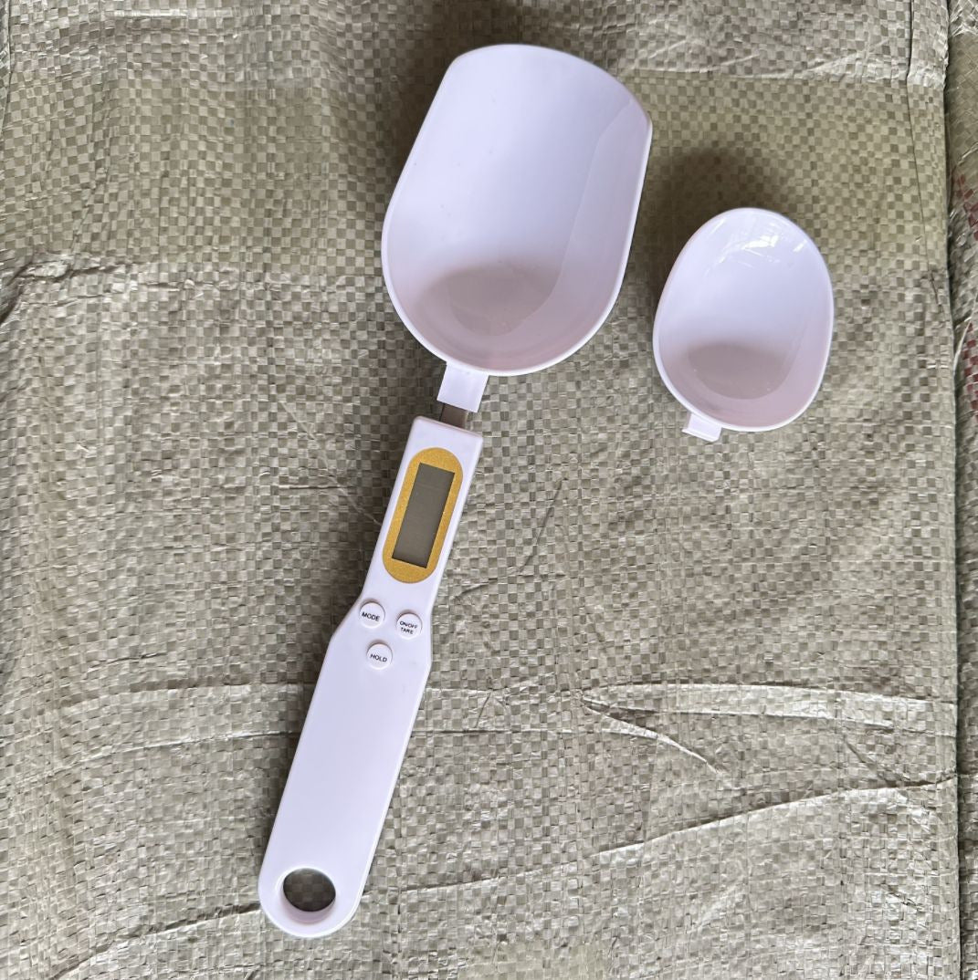 White digital measuring spoon scale with LCD screen and two measuring bowls
