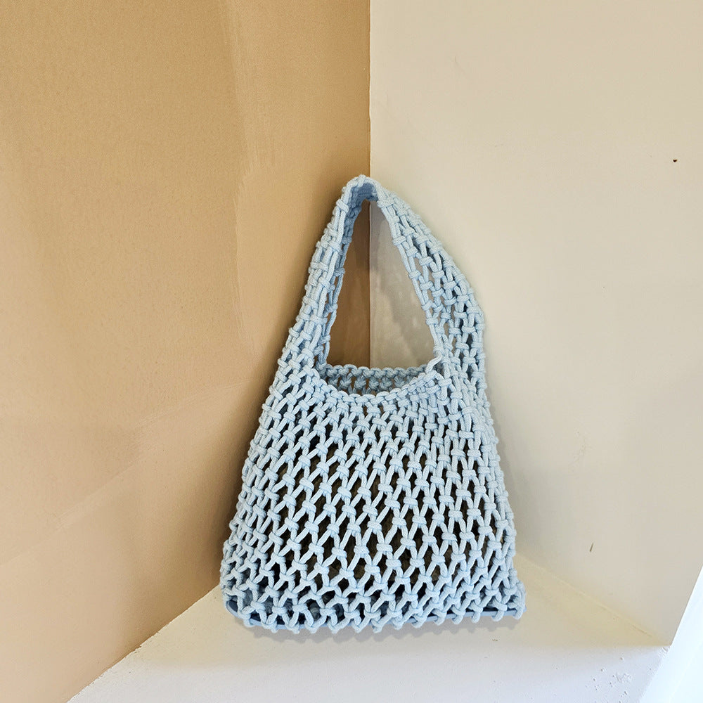 Light blue woven cotton rope bucket bag with openwork net mesh and loop handle