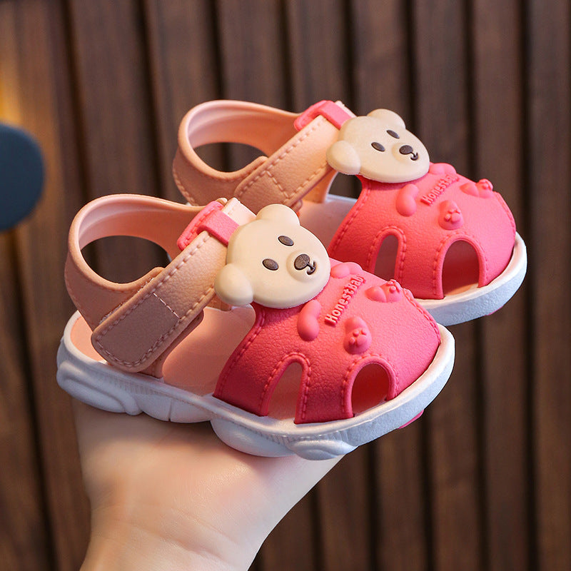 Pair of children's bear-face sandals in coral pink and brown with cushioned sole