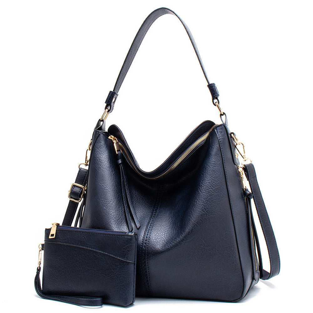 Black PU leather shoulder crossbody bag with front zip pocket and side tassel