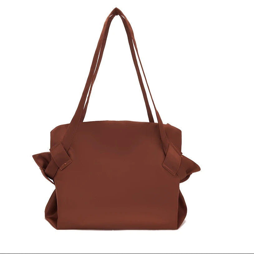 Dark brown large-capacity travel duffel bag with side pockets and short handles