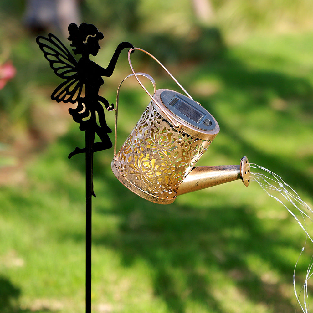 Solar outdoor projection lamp showing bronze lantern with solar panel and black fairy silhouette