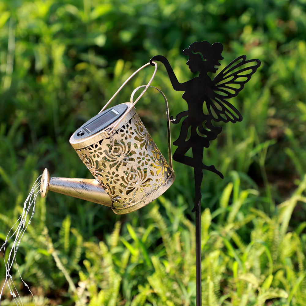 Solar outdoor projection lamp: bronze lantern with gold cutout pattern on black fairy stand