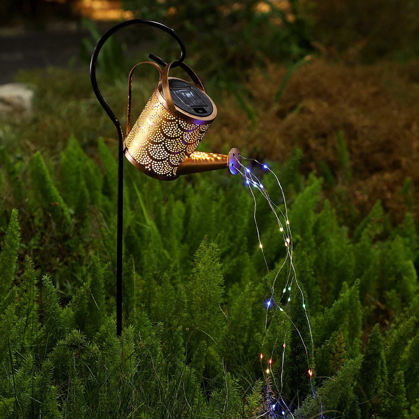 Copper solar projection lawn lamp with multicolor blue light stream across plants