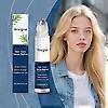 Hair serum roll-on bottle held near hair; blue product boxes beside person.