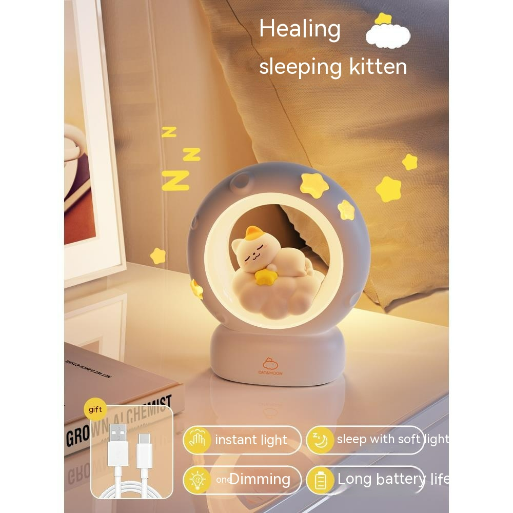 Blue moon night light lamp featuring sleeping kitten in round lit window on stand
