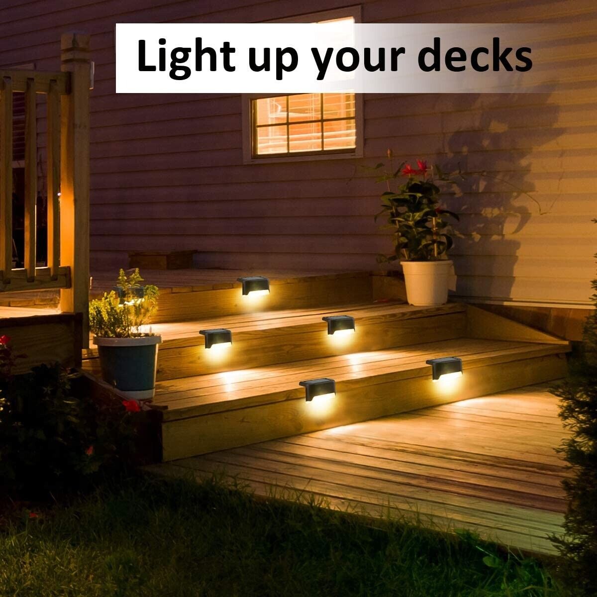 Solar deck step lights with warm glow along a wooden deck at night