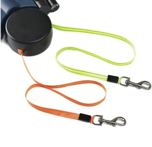 Dual retractable dog leash with black reel and two extendable leads with clips