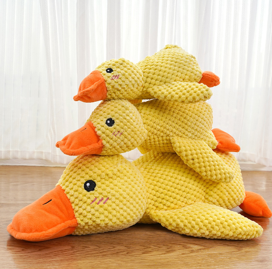 Yellow plush duck toy with orange beak and feet, stacked duck heads, soft textured fabric