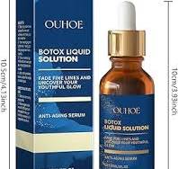 Anti-aging serum bottle with gold dropper next to blue carton side