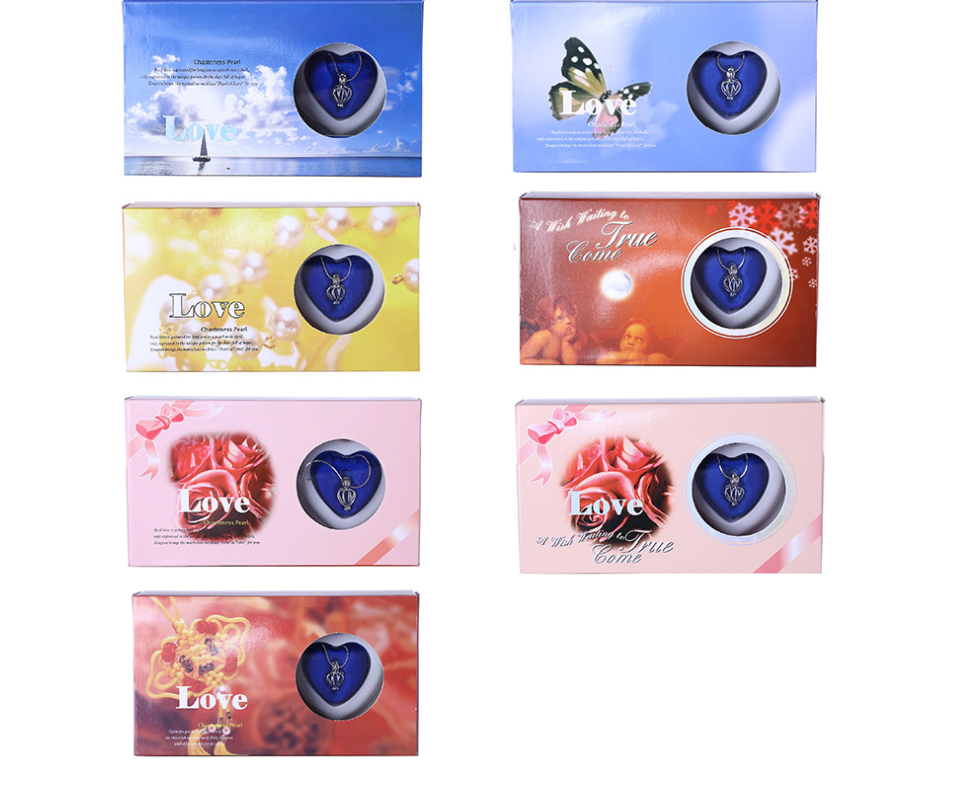 Wish pearl necklace gift boxes showing blue heart pendants in heart-shaped holders