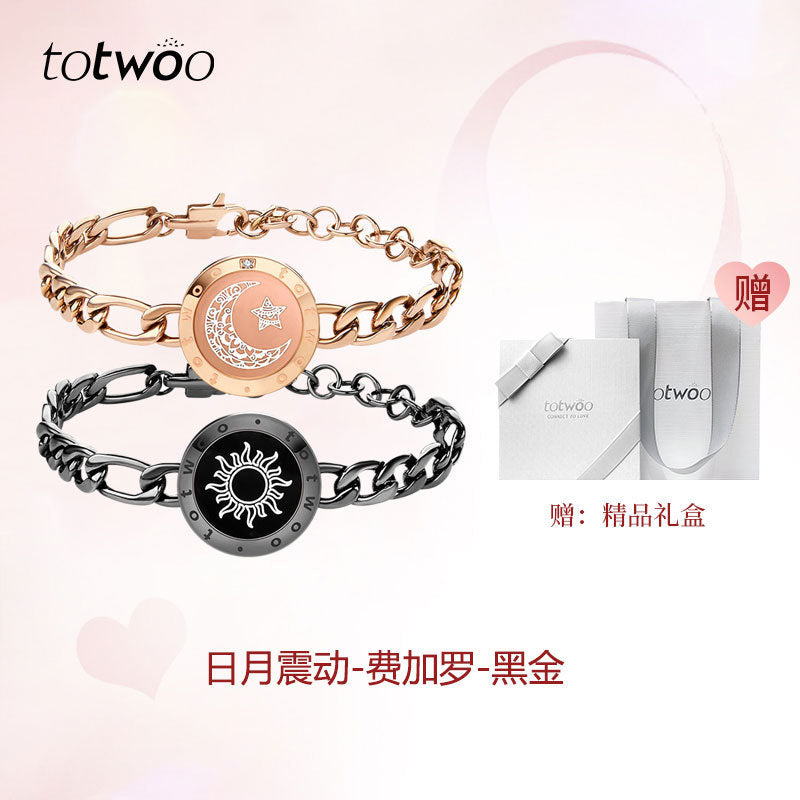 Gold and black smart couple bracelets with round charm discs and chain links