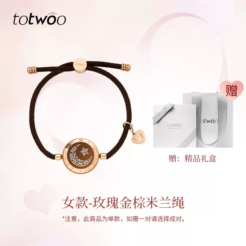 Black cord smart bracelet with rose-gold round moon-and-star charm disc