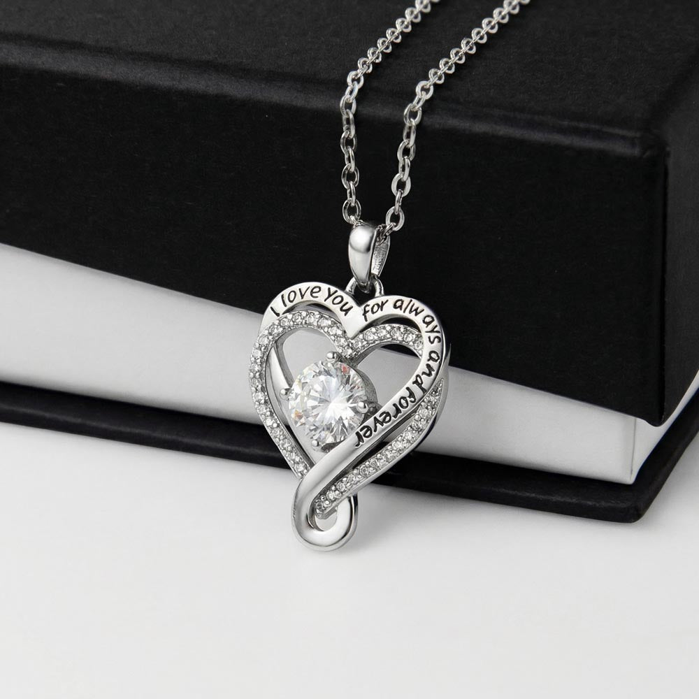 Heart CZ pendant necklace on a silver chain, with round center stone and halo details