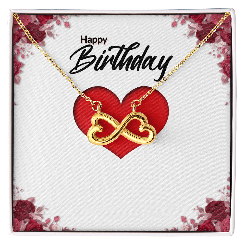 Gold infinity heart necklace with red heart pendant and linked infinity centerpiece