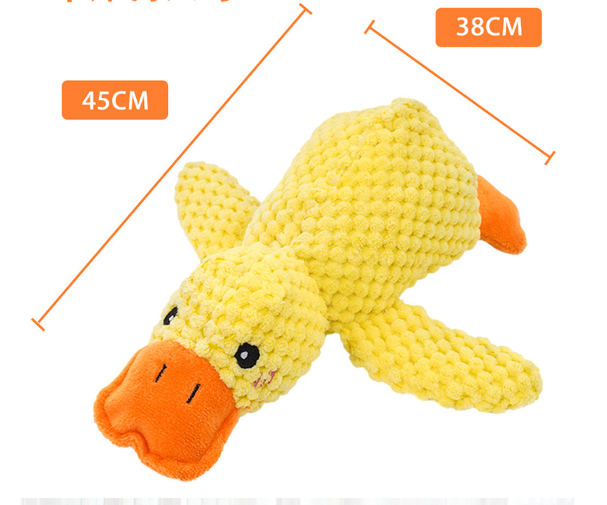Yellow plush duck toy with orange beak and feet, angled view on white background