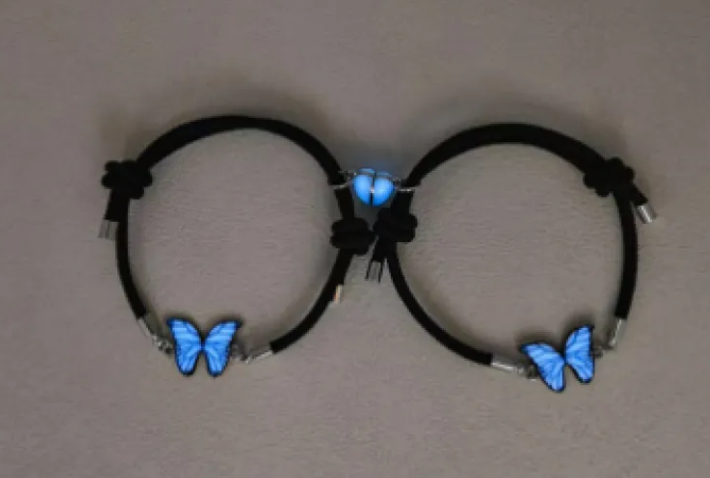 Black butterfly charm bracelets with blue butterfly details