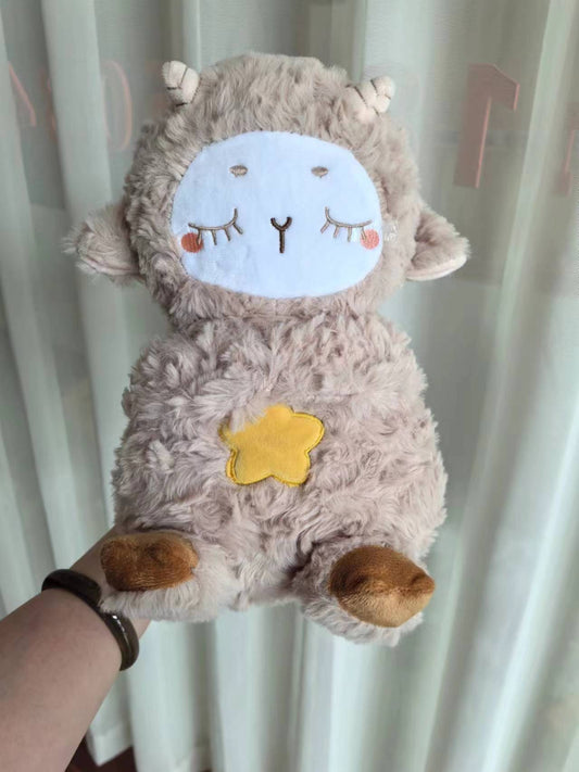 Gray plush otter sound machine with stitched face and glowing star on belly