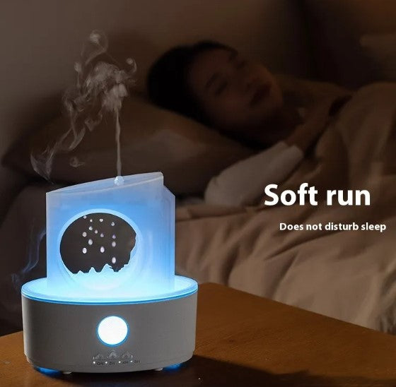 Blue-lit ultrasonic humidifier emitting mist beside a bed on a wooden surface