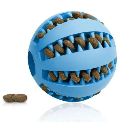 Dog treat dispensing rubber ball in blue with ridged channels and small kibble pieces