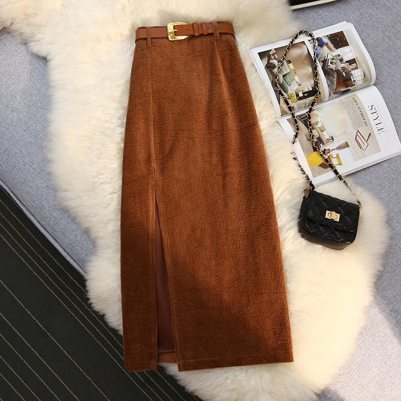 Brown high-waist corduroy A-line skirt with front slit, fitted waistband belt.