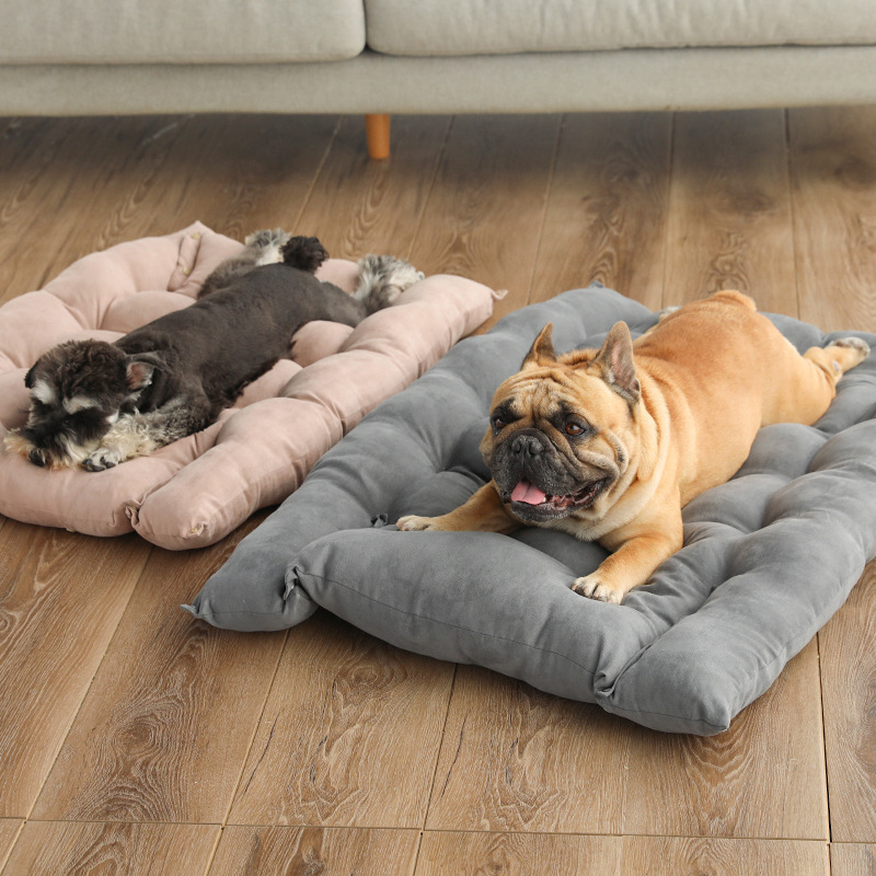 Foldable pet nest sofa bed with beige and gray cushions on wooden floor for pets