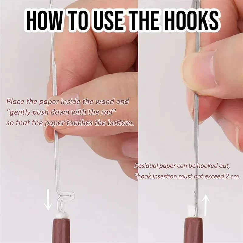 Magic wand toy shown with paper being inserted into handle, close-up of hands