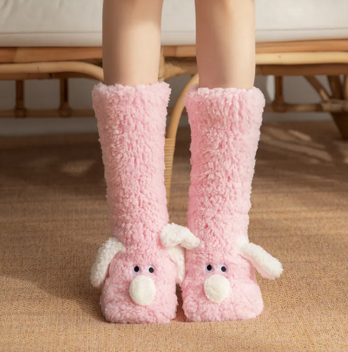 Women’s plush dog socks in pink with white paw pads and cute dog face