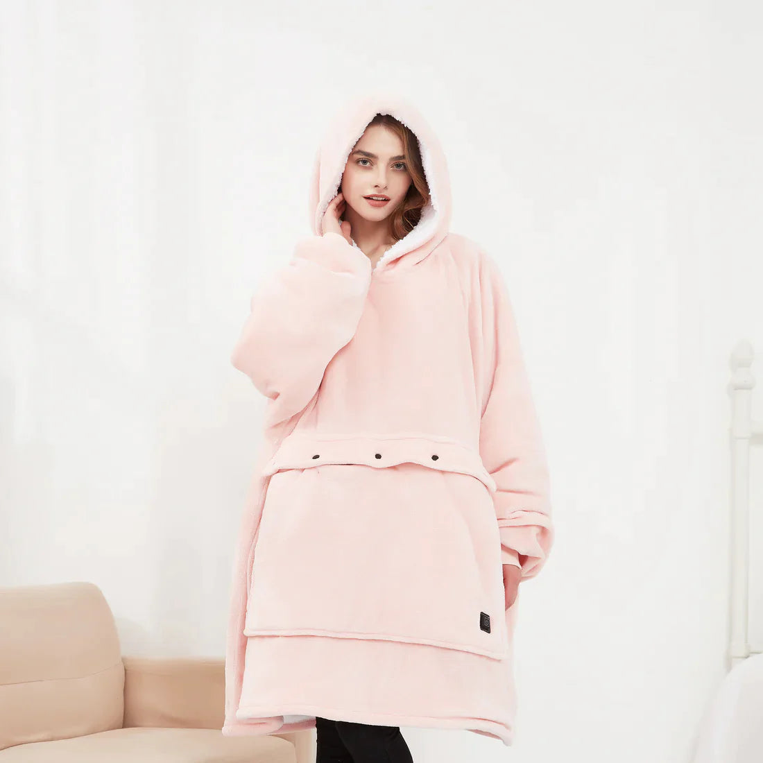 Heated hoodie blanket with hood, pale pink plush with ribbed hem and side pocket