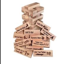 Wooden Jenga-style couples game with stacked tower and prompt blocks