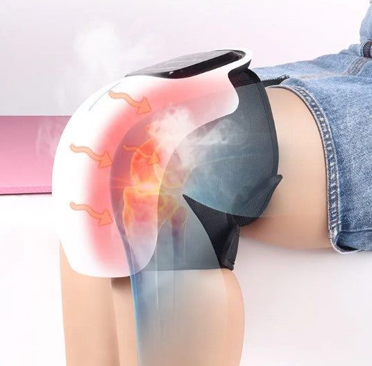 Electric knee massager with strap on knee, showing illuminated heat/vibration area