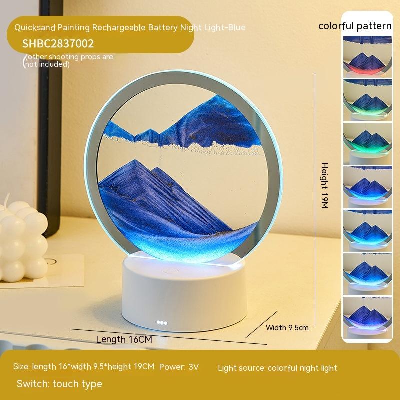 Quicksand night lamp with circular glass top and white base, blue sand glow