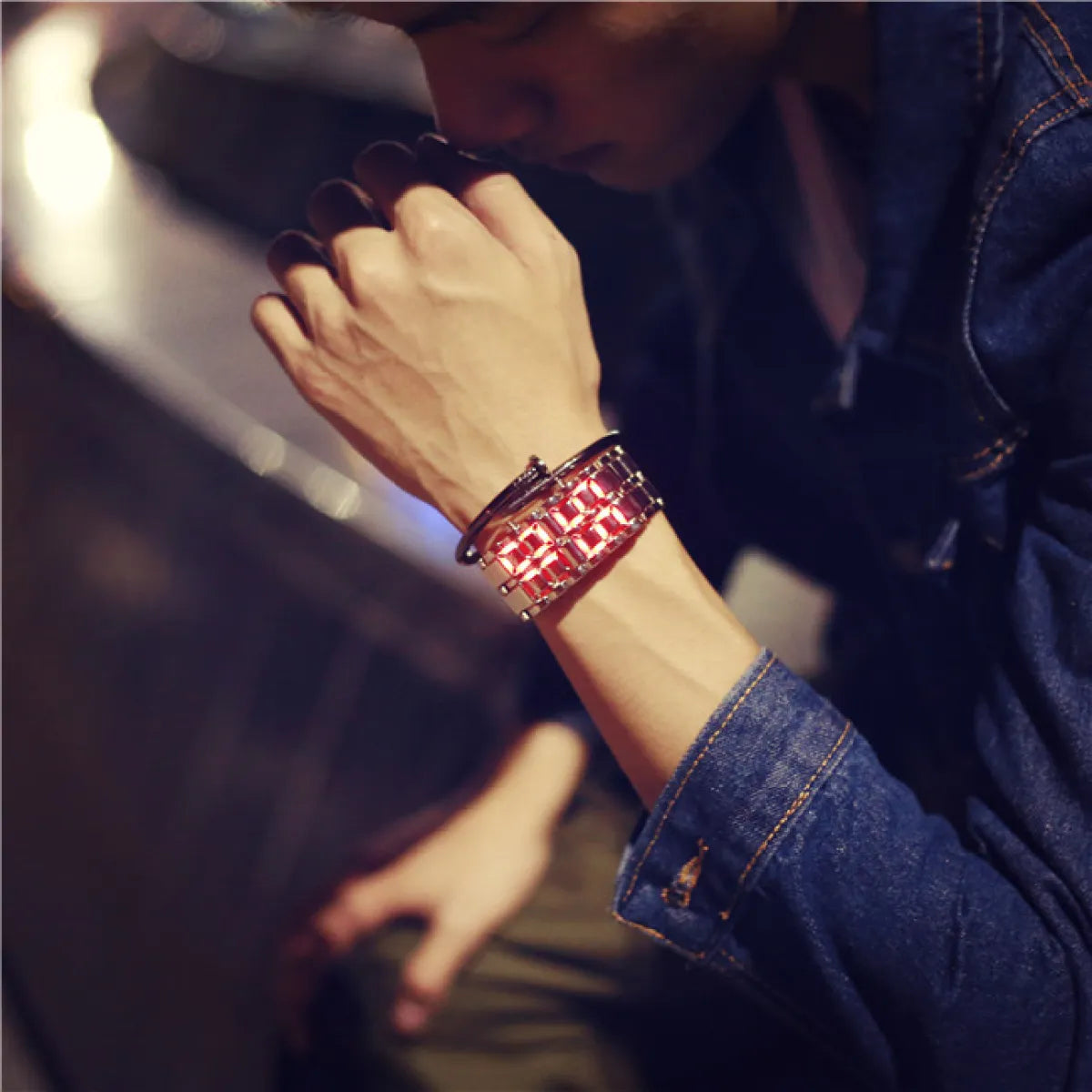 LED lava flow watch with red LED display on dark metal bracelet