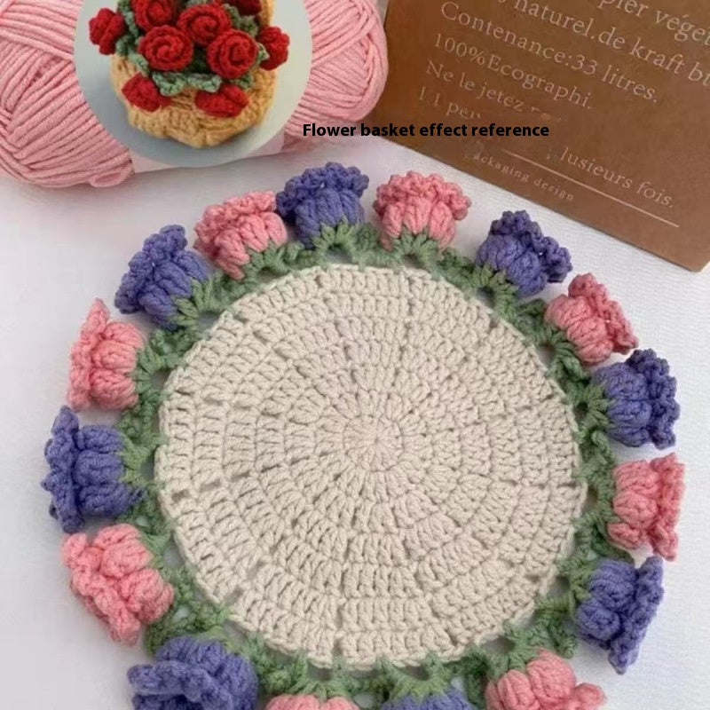 Round crocheted coaster with cream center and multicolor rose border in pink and blue