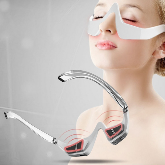 White eye massager worn on face with red light panels and contact pads
