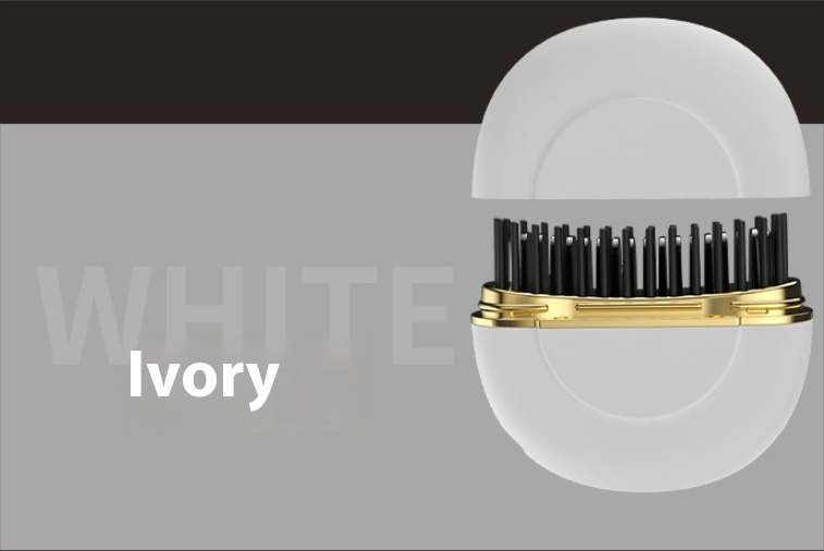 Portable ceramic hair straightener in ivory with gold trim and black round comb teeth