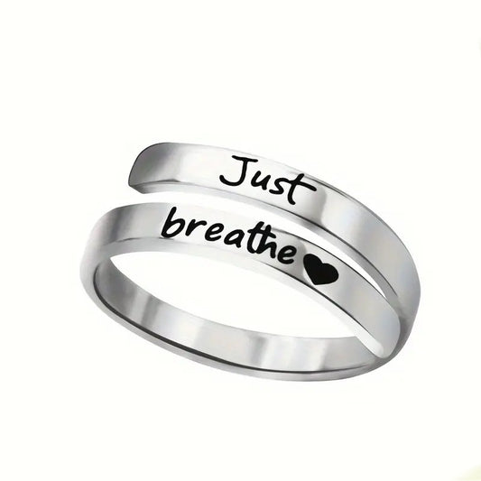 Silver spiral heart ring with engraved "Just breathe" and small heart detail