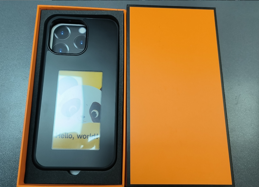 Black iPhone case with e-ink display and protective packaging insert