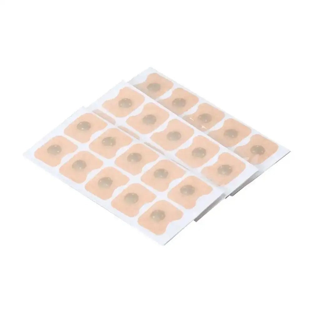 Sheet of beige adhesive nose patches with circular centers